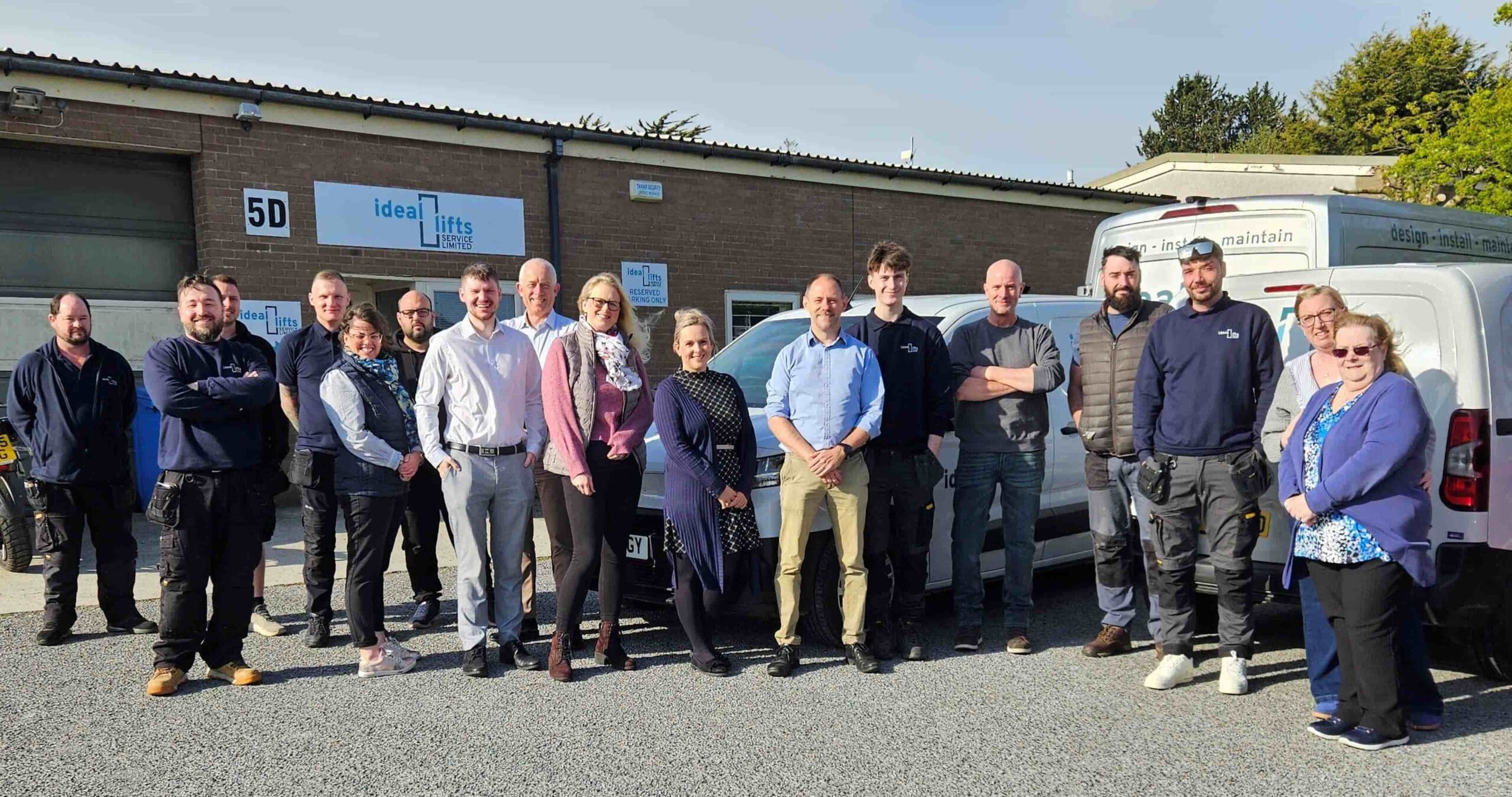 Ideal Lifts team photo in front of their office